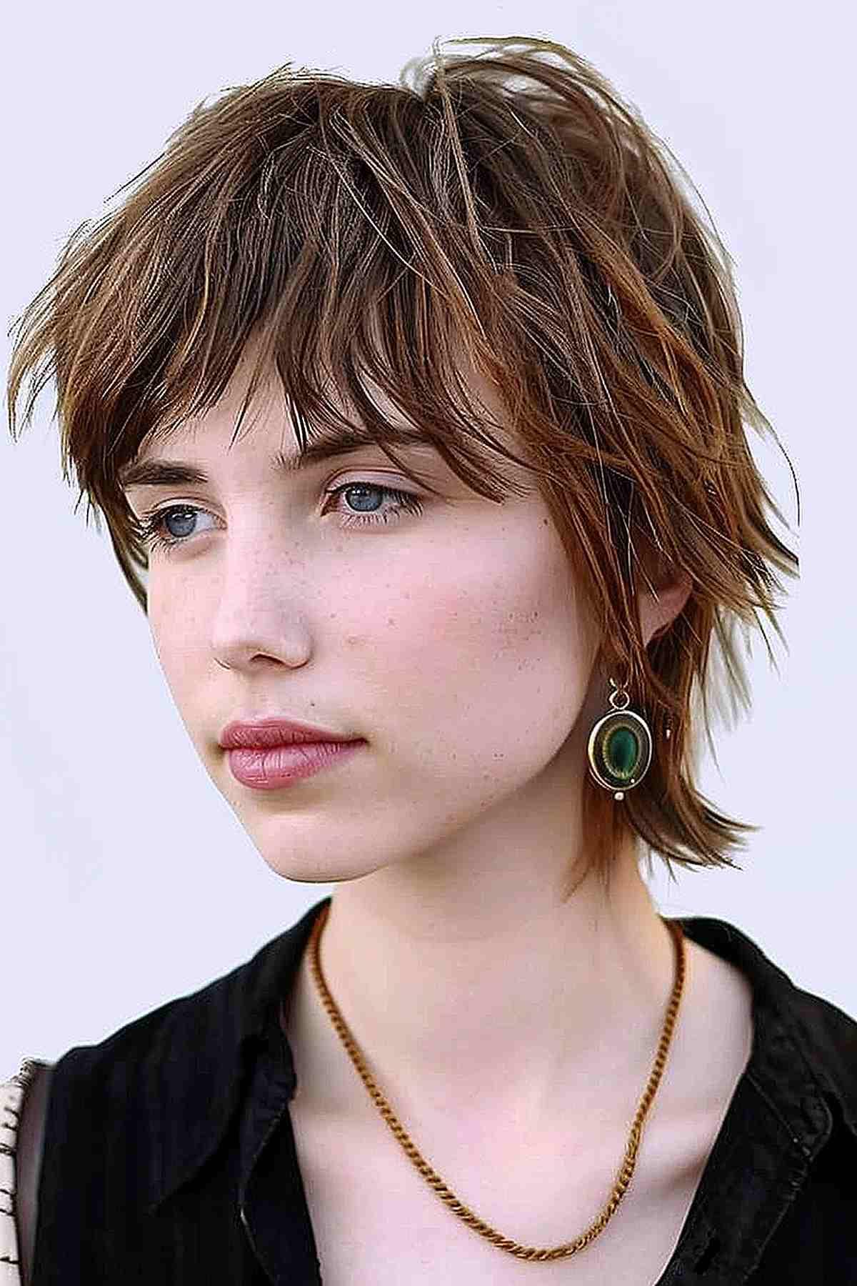 Elf haircut with mullet layers, featuring short top layers blending into longer layers at the back.