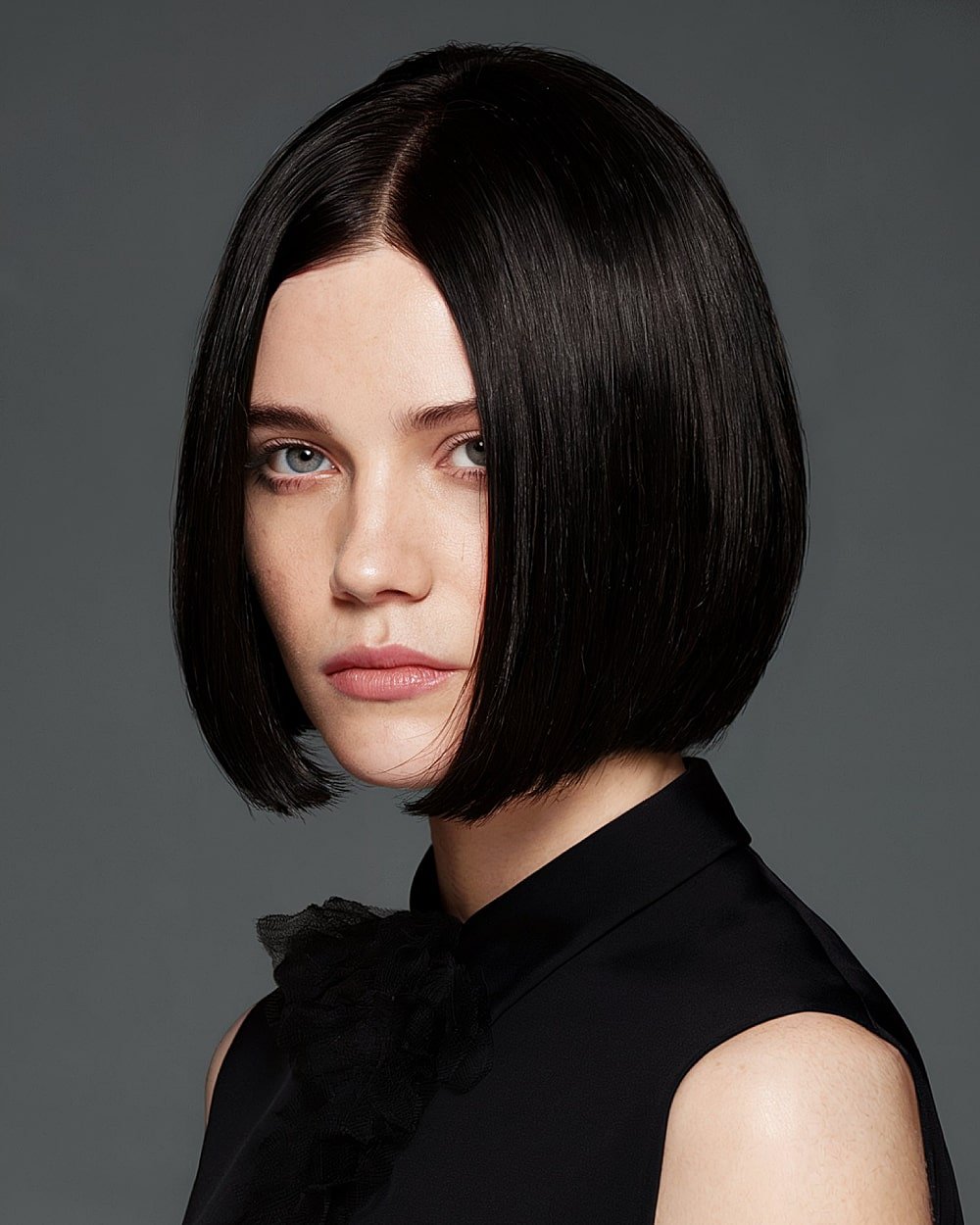 Glossy pinch bob with center part and ultra-sleek finish for medium to thick straight hair
