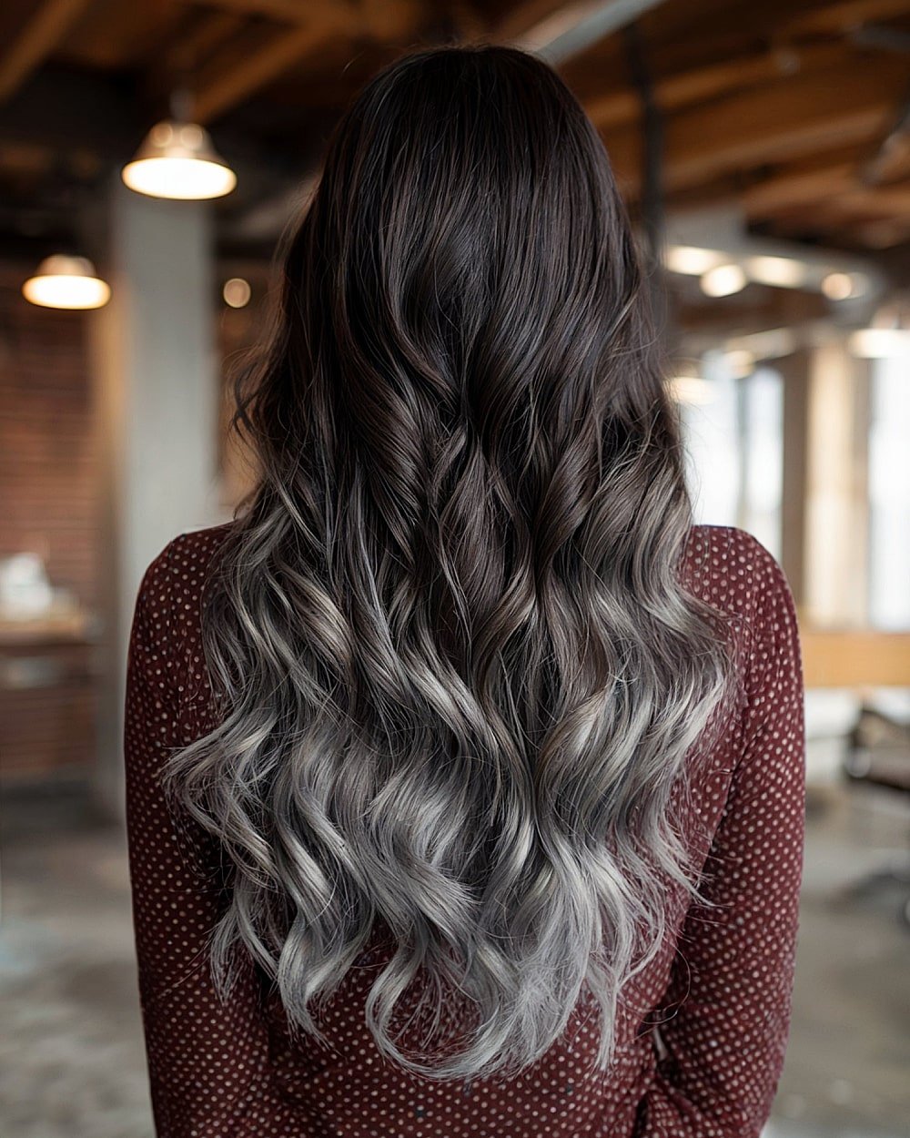 Long dark to steel grey ombre hair with soft waves and blended layers